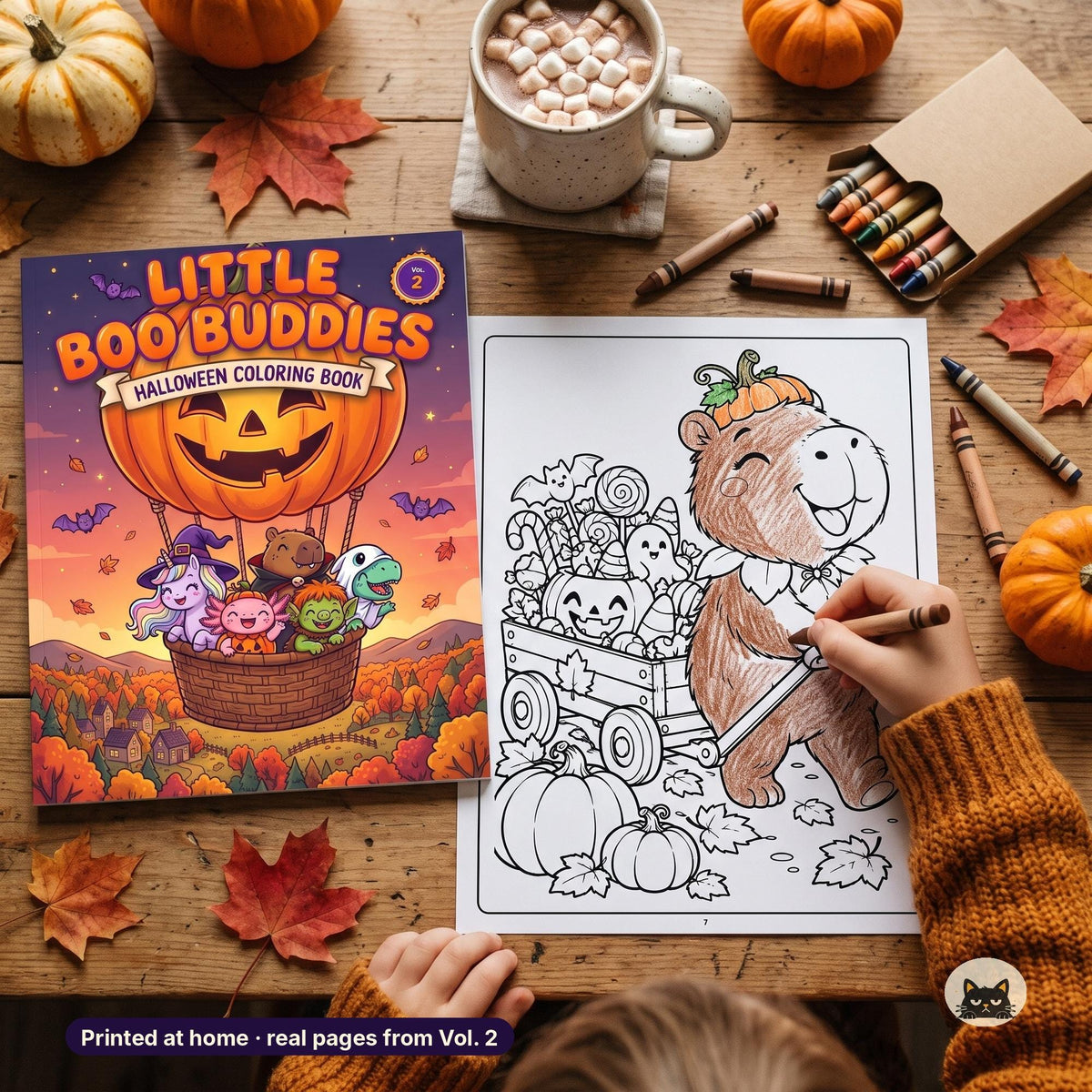 May include: A Halloween coloring book titled Little Boo Buddies Vol. 2 featuring a pumpkin hot air balloon with cartoon characters. Next to it, a partially colored page shows a capybara pulling a wagon filled with candy and pumpkins.